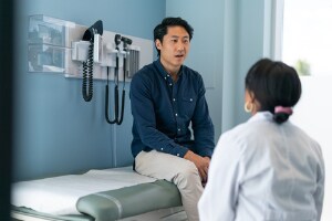 young man speaking with doc