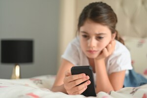 young girl on phone