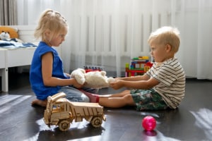 kids fighting over toy